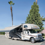 mighty-class-c-large-motorhome-6-berth-exterior-with-awning