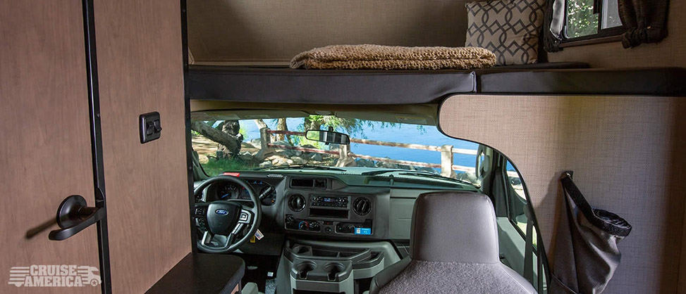 Cruise America Compact Plus RV-drivers-seat-and-loft