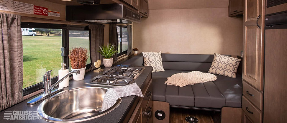 Cruise America Compact Plus RV-kitchen-bed