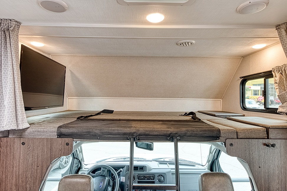 El Monte RV C Family Sleeper-Interior_bed_above_driver_built