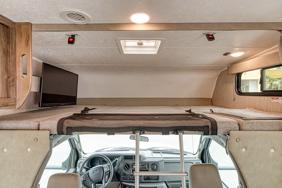 El Monte RV Class C Large-Interior_bed_above_driver_built