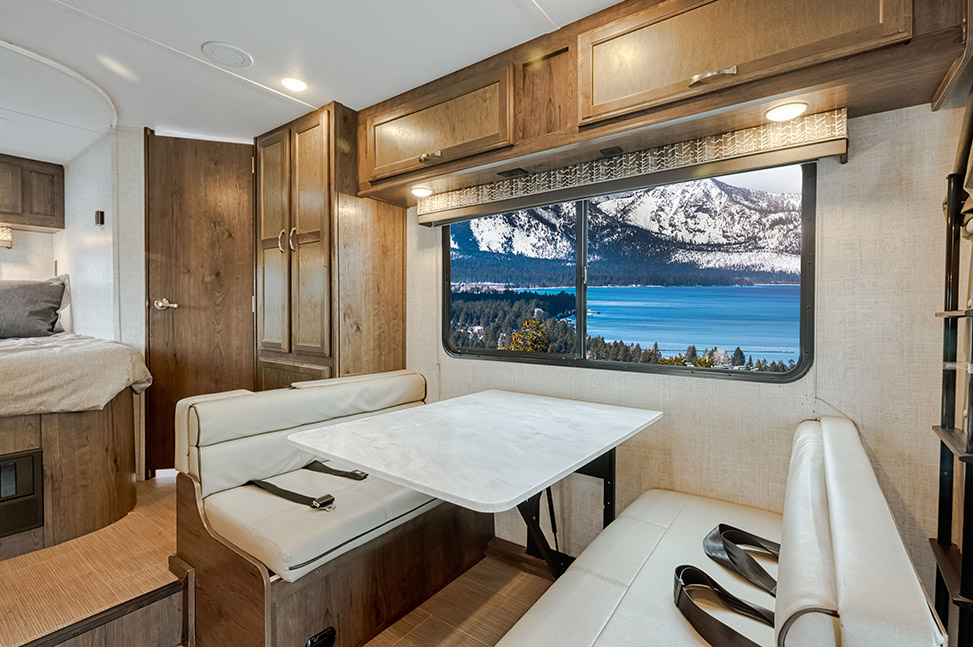 El Monte RV Class C Small-Interior_dining_table_bed