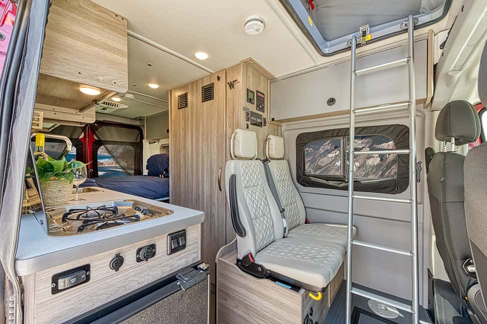 Road Bear RV Class B 20-22'-Interior_front_seats_and_kitchen