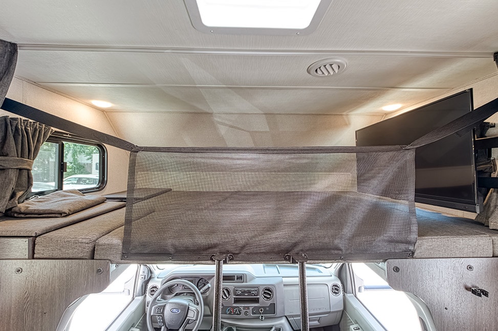 Road Bear RV Class C 29-31' With Slide-Out-Interior_bed_above_driver_guard